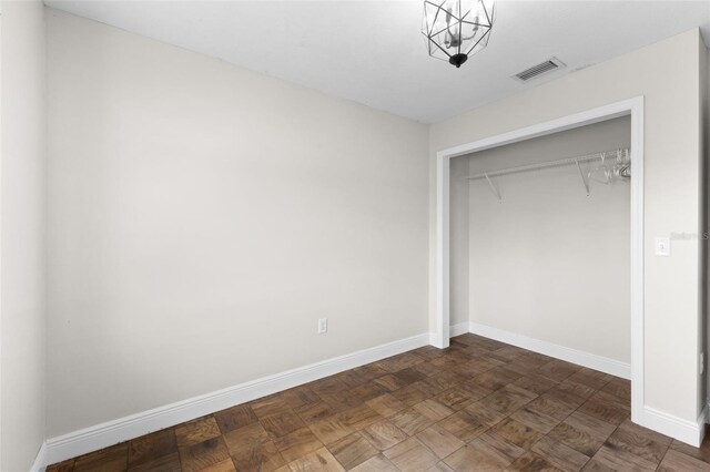 445 Horseshoe Loop Rd, Terra Ceia, FL 34250 - unfurnished bedroom with baseboards and a closet