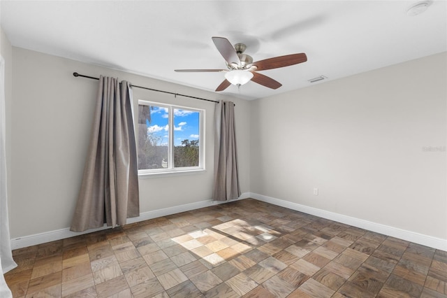 unfurnished room with ceiling fan