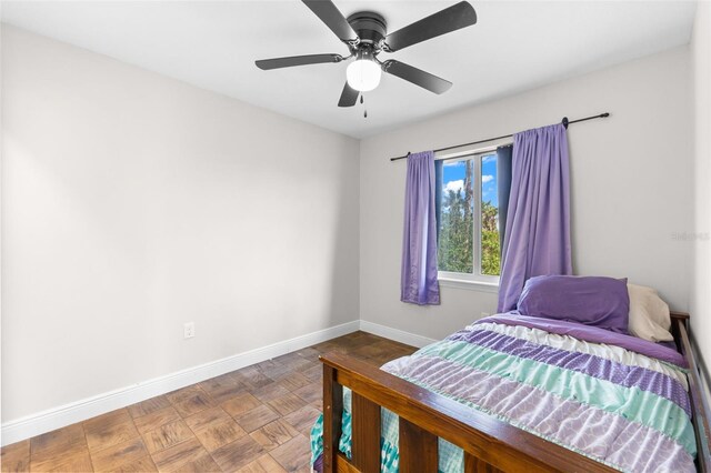 445 Horseshoe Loop Rd, Terra Ceia, FL 34250 - bedroom featuring baseboards and a ceiling fan