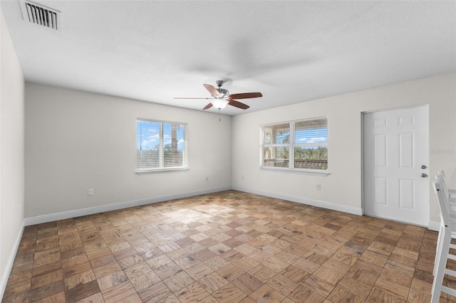 445 Horseshoe Loop Rd, Terra Ceia, FL 34250 - empty room with a ceiling fan and baseboards