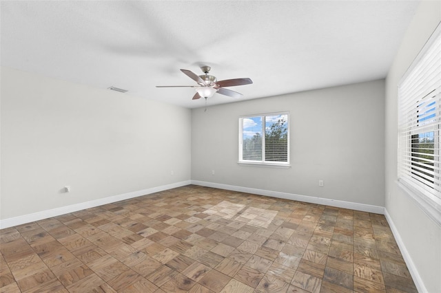 spare room with ceiling fan