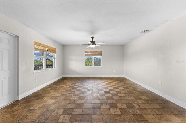 445 Horseshoe Loop Rd, Terra Ceia, FL 34250 - spare room with baseboards and ceiling fan