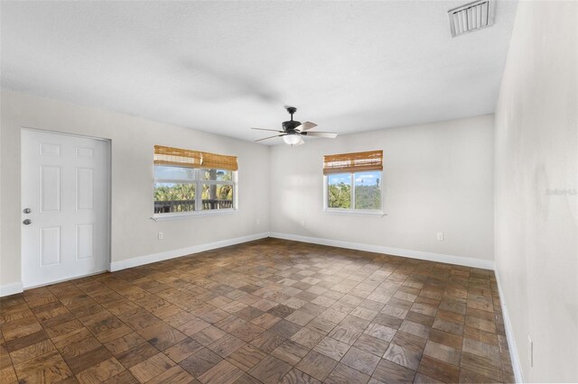 445 Horseshoe Loop Rd, Terra Ceia, FL 34250 - empty room with plenty of natural light and baseboards