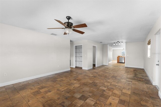 445 Horseshoe Loop Rd, Terra Ceia, FL 34250 - unfurnished living room featuring baseboards and a ceiling fan