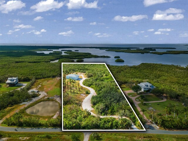 445 Horseshoe Loop Rd, Terra Ceia, FL 34250 - aerial view of property's location featuring a nearby body of water and property boundaries highlighted