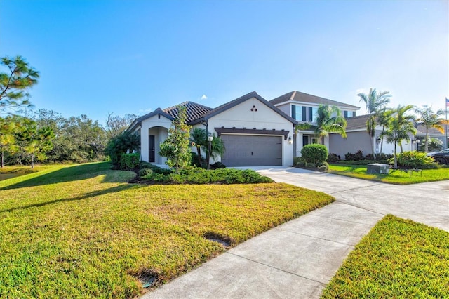 view of front of home featuring a garage and a front lawn