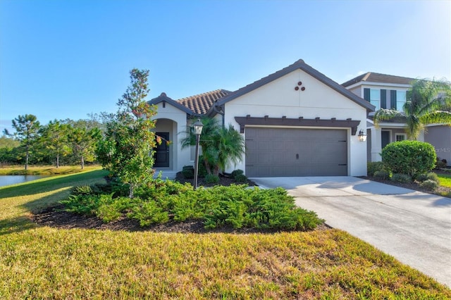 view of front facade featuring a front yard and a garage