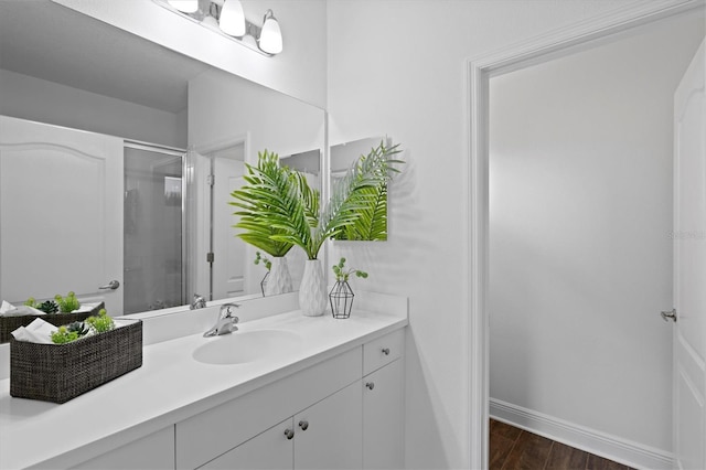 bathroom featuring vanity and an enclosed shower