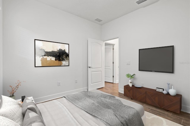 bedroom with wood-type flooring