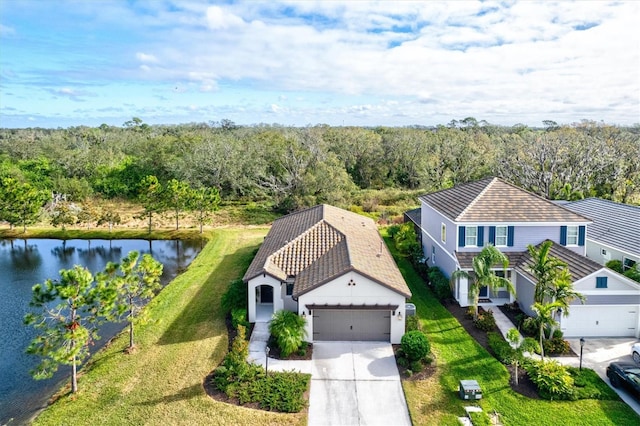 birds eye view of property featuring a water view