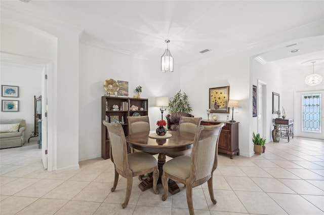 tiled dining room with ornamental molding