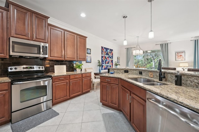 kitchen with sink, stainless steel appliances, tasteful backsplash, crown molding, and decorative light fixtures