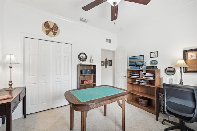 rec room with light tile patterned floors, ceiling fan, and crown molding