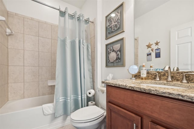 full bathroom with shower / tub combo with curtain, vanity, and toilet