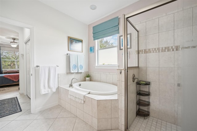 bathroom with tile patterned flooring, ceiling fan, and plus walk in shower