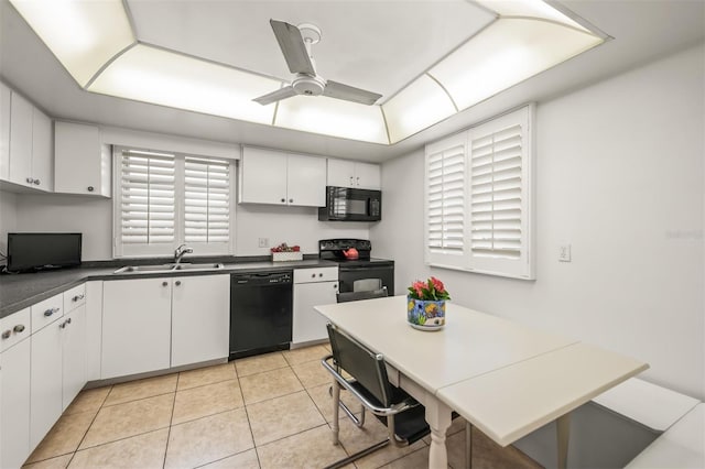 kitchen featuring light tile patterned floors, sink, white cabinetry, and black appliances