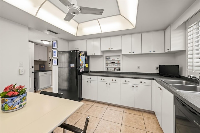 kitchen featuring black appliances, sink, ceiling fan, light tile patterned floors, and white cabinetry