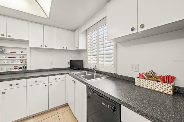 kitchen featuring dishwasher, light tile patterned flooring, white cabinetry, and sink