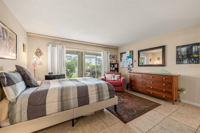 tiled bedroom with a textured ceiling