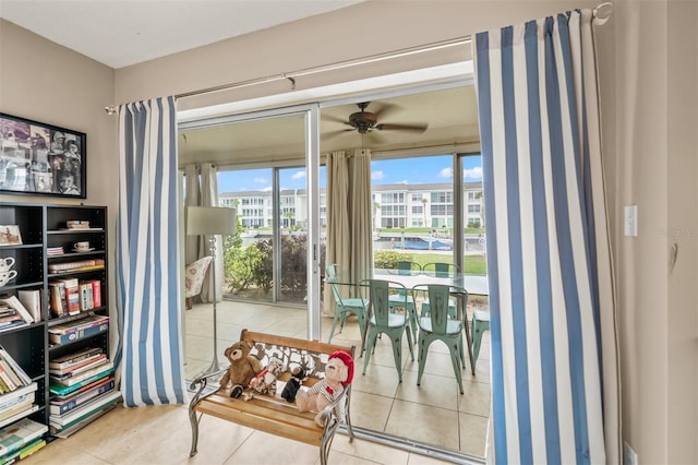 interior space featuring ceiling fan and light tile patterned flooring