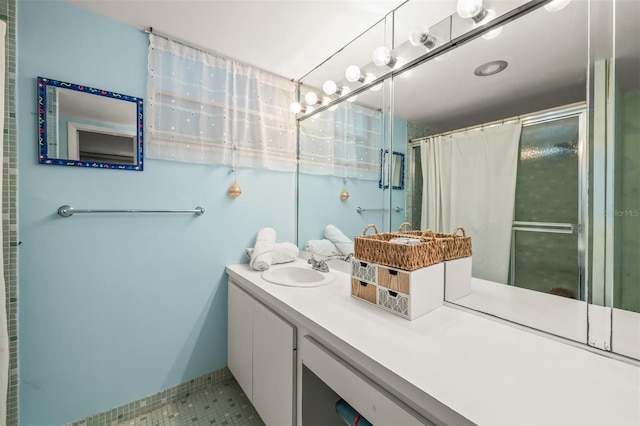 bathroom featuring a shower with shower curtain, vanity, and tile patterned floors