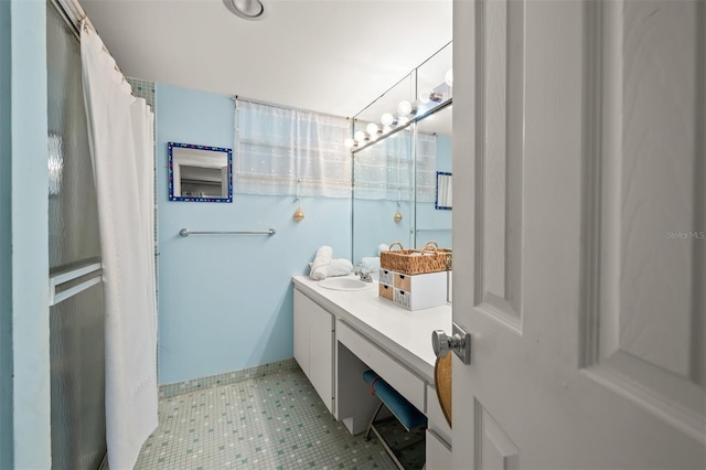 bathroom with tile patterned flooring and vanity