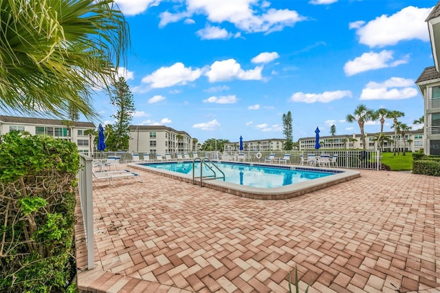 view of swimming pool with a patio