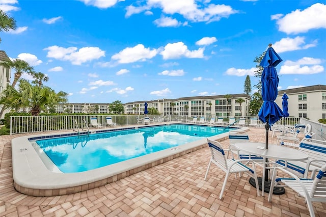 view of swimming pool with a patio