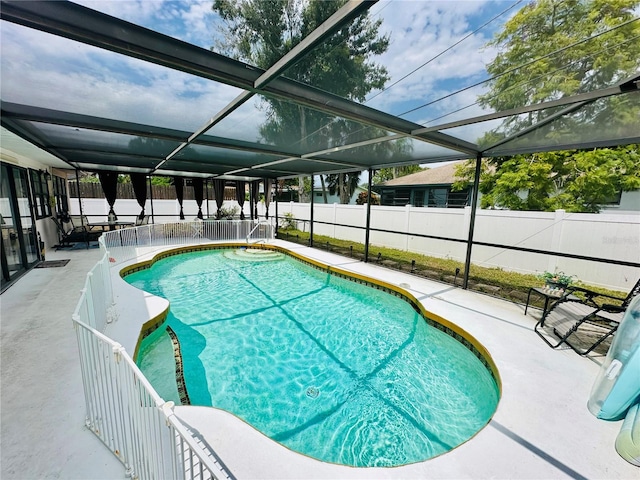 view of pool featuring a lanai, a patio area, a fenced backyard, and a fenced in pool