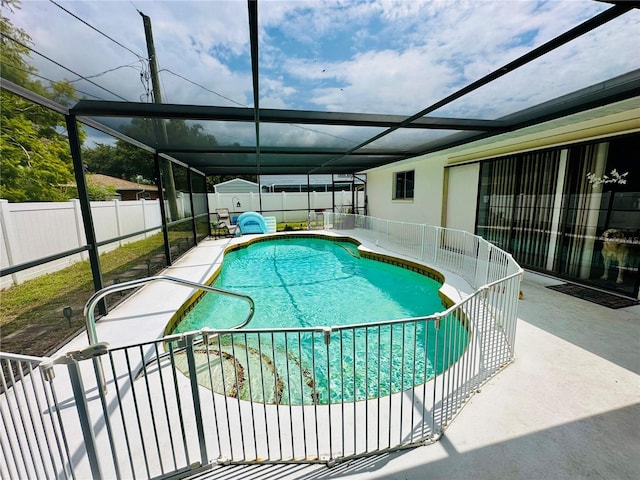 view of pool featuring a lanai and a patio