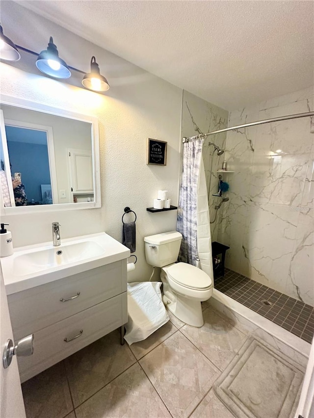 bathroom featuring vanity, a textured ceiling, toilet, and walk in shower