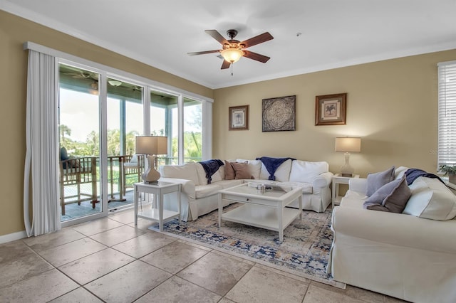 living room with ceiling fan and ornamental molding