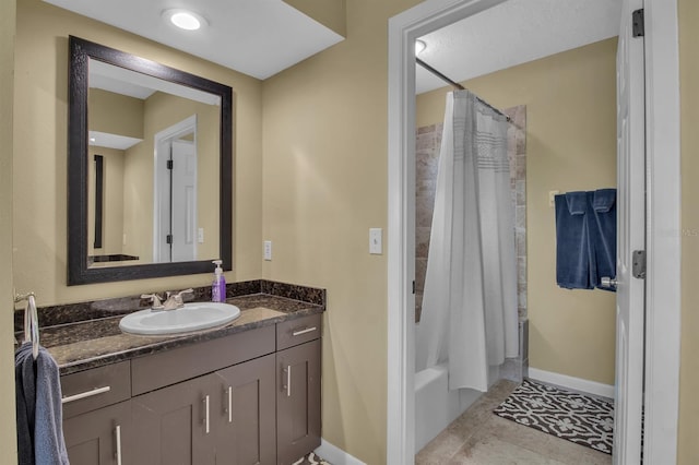 bathroom with tile patterned flooring, vanity, and shower / tub combo with curtain