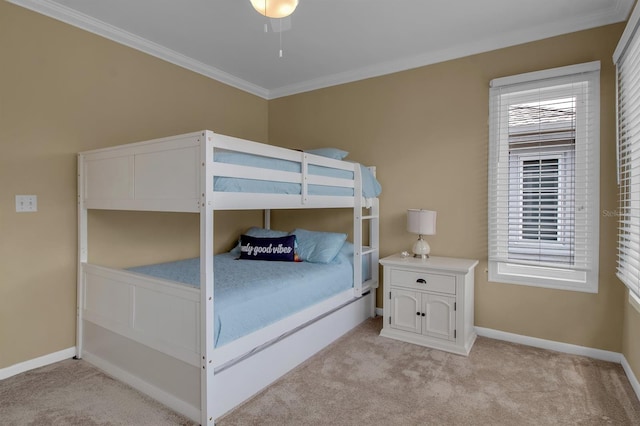 unfurnished bedroom featuring crown molding, ceiling fan, and light colored carpet