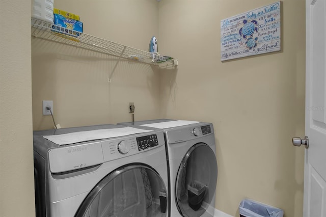 laundry room featuring separate washer and dryer