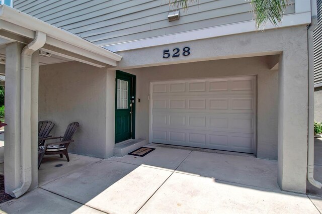 doorway to property featuring a garage