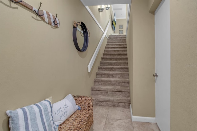 stairs with tile patterned flooring