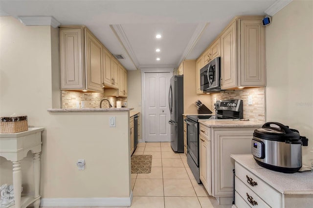 4119 61st Avenue Terrace W Unit 105, Bradenton, FL 34210 - kitchen featuring stainless steel appliances, recessed lighting, tasteful backsplash, light tile patterned floors, and cream cabinets