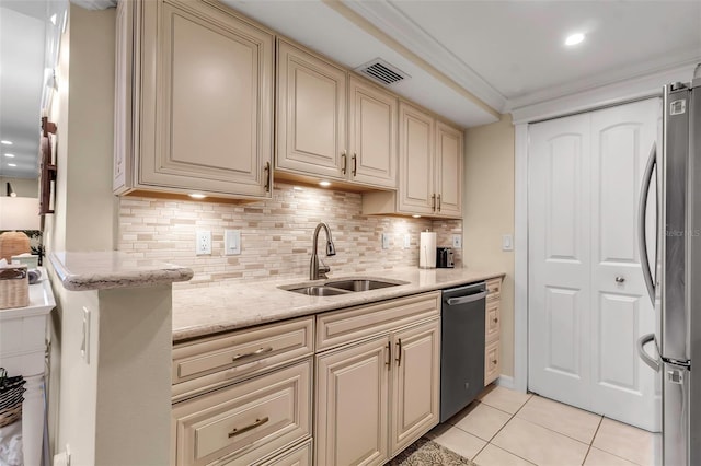 4119 61st Avenue Terrace W Unit 105, Bradenton, FL 34210 - kitchen with appliances with stainless steel finishes, a sink, cream cabinetry, light tile patterned flooring, and backsplash
