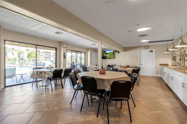 4119 61st Avenue Terrace W Unit 105, Bradenton, FL 34210 - dining space featuring light tile patterned flooring