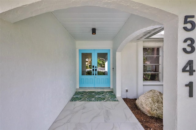 entrance to property featuring french doors