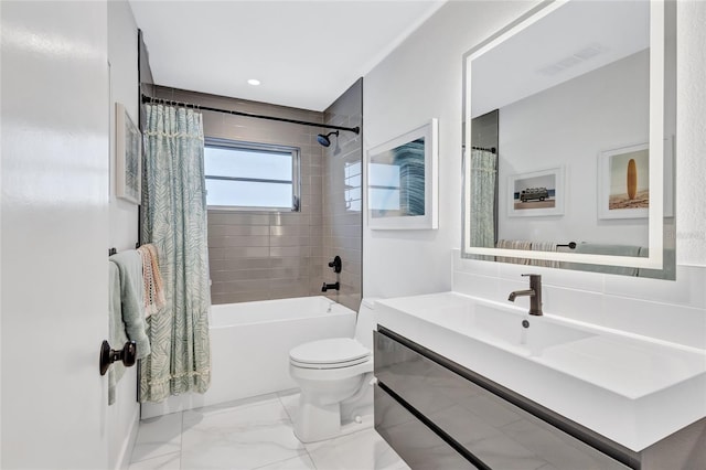 full bathroom with shower / bath combination with curtain, vanity, and toilet