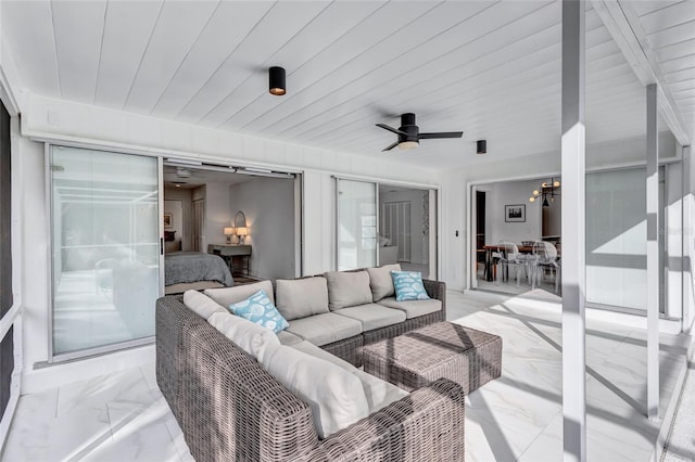 exterior space featuring wooden ceiling and ceiling fan with notable chandelier