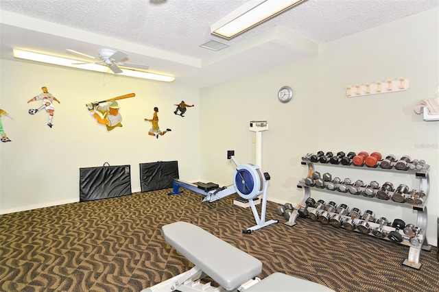 exercise room featuring a textured ceiling, ceiling fan, and carpet floors