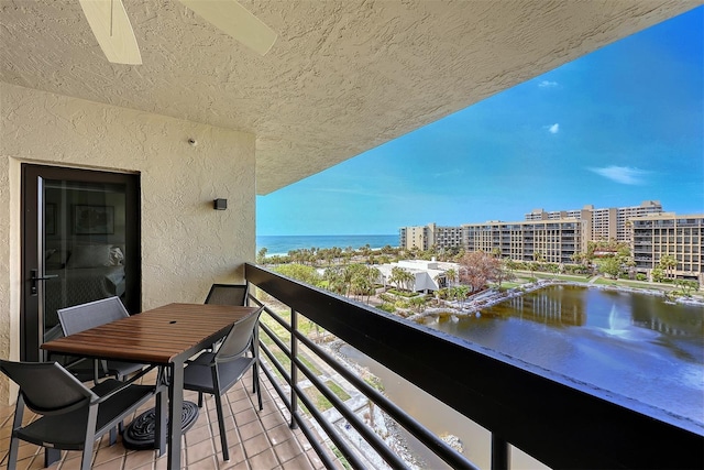 balcony featuring a water view