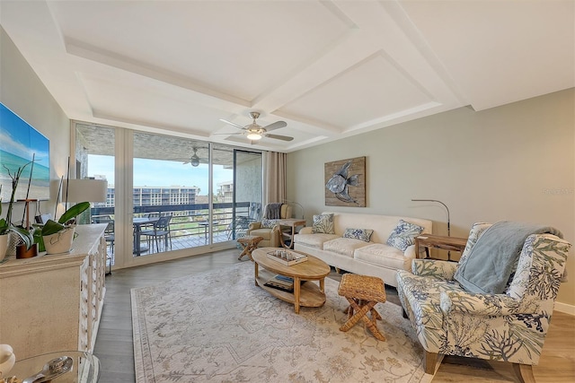 living room with coffered ceiling, wood-type flooring, ceiling fan, and expansive windows