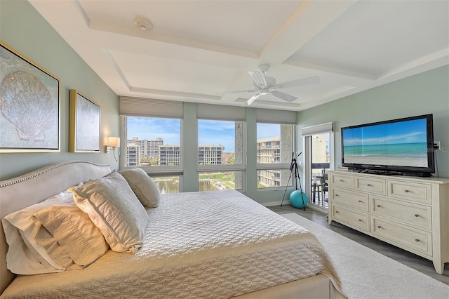 bedroom featuring ceiling fan, coffered ceiling, and beamed ceiling