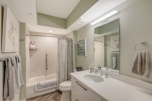 full bathroom featuring shower / bath combination with curtain, toilet, vanity, and wood-type flooring