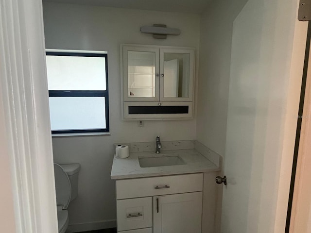 bathroom with vanity and toilet