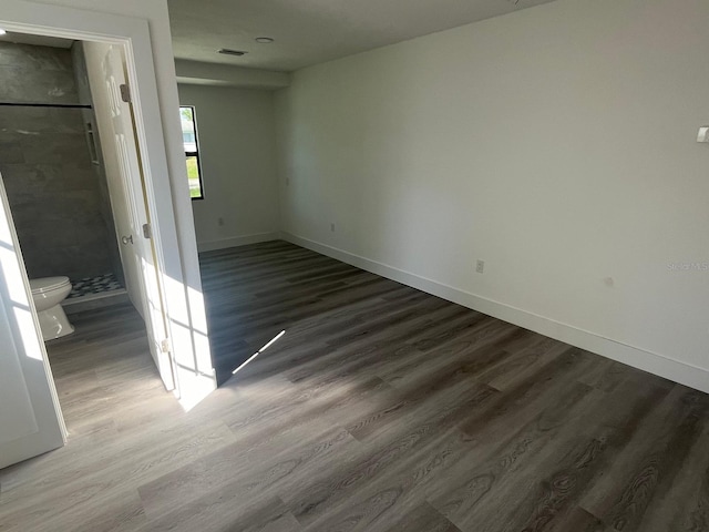 spare room featuring dark hardwood / wood-style floors